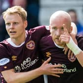 Gary Mackay-Steven (left) celebrates with Hearts team-mate Liam Boyce, who scored in the 3-2 win over St Johnstone before being stretchered off. (Photo by Ross Parker / SNS Group)