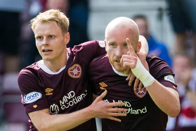Gary Mackay-Steven (left) celebrates with Hearts team-mate Liam Boyce, who scored in the 3-2 win over St Johnstone before being stretchered off. (Photo by Ross Parker / SNS Group)