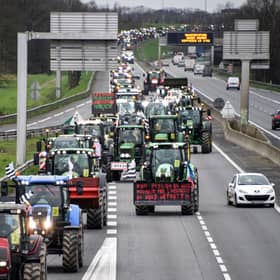 Farmers drive their tractors on the ring road of Rennes, western France, on February 1 (Photo by SEBASTIEN SALOM-GOMIS/AFP via Getty Images)