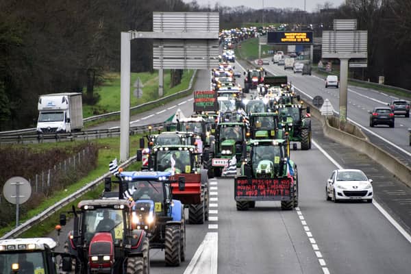 Farmers drive their tractors on the ring road of Rennes, western France, on February 1 (Photo by SEBASTIEN SALOM-GOMIS/AFP via Getty Images)