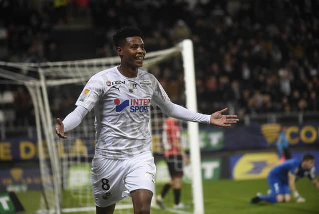 Bongani Zungu, pictured celebrating a goal for Amiens against Rennes last December, will join the Rangers squad for training ahead of their Europa League match against Lech Poznan on Thursday night. (Photo by FRANCOIS LO PRESTI/AFP via Getty Images)