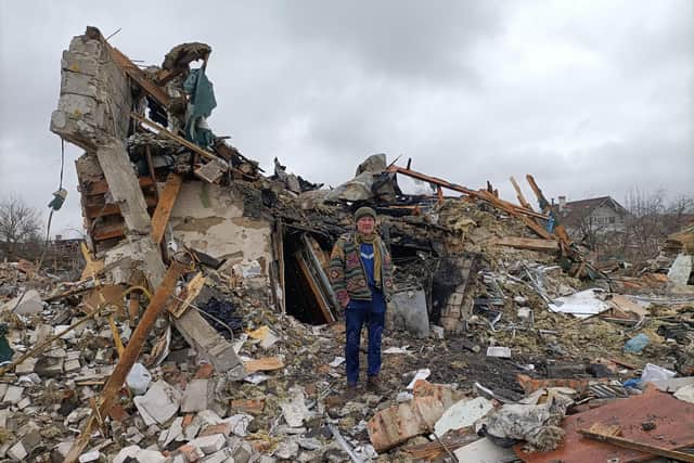 A Ukrainian man stands amid the rubble of houses destroyed by Russian shelling in Zhytomyr. At least three people were killed (Picture: Emmanuel Duparcq/AFP via Getty Images)
