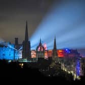 Lights from Edinburgh Castle's 'Castle of Light' event illuminate the city skyline. The tourist sector in Scotland has been badly hit by the emergence of the Omicron variant, with events such as Edinburgh's Hogmanay festivities cancelled. Picture: Jane Barlow/PA Wire