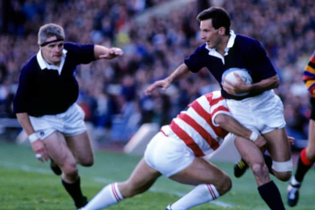 Sean Lineen, with Finlay Calder in support, in action for Scotland against Japan at the 1991 World Cup.