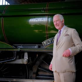 King Charles in front of The Flying Scotsman at Pickering Station
