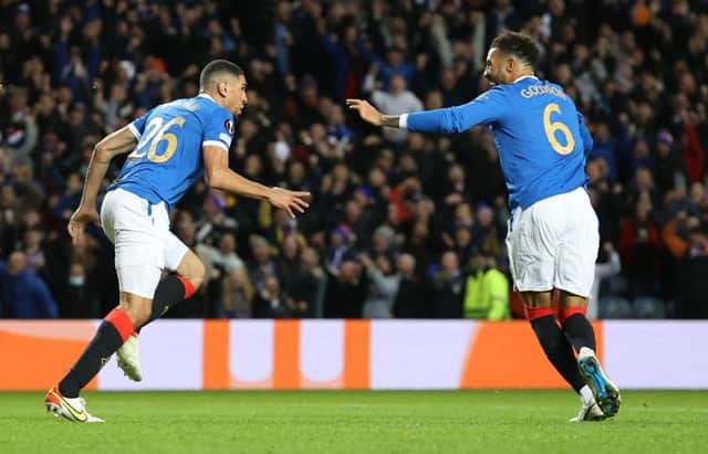 Connor Goldson (right) celebrates with Leon Balogun (left) after Rangers' opening goal in the 2-0 Europa League win over Brondby at Ibrox on Thursday night. (Photo by Craig Williamson / SNS Group)