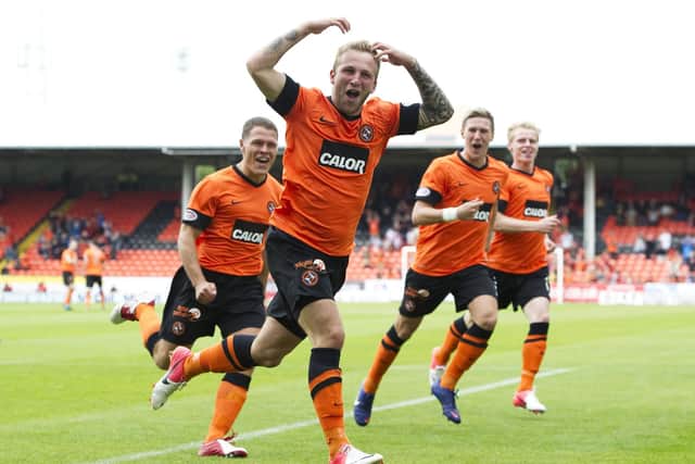 Celebrating his wonder goal for Dundee United in the Tayside derby in 2012.