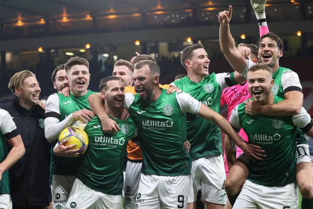 GLASGOW, SCOTLAND - NOVEMBER 21: Hibs' Martin Boyle celebrates his hat-trick with the matchball and Christian Doidge (centre), Ryan Porteous (right) and Joe Newell (top right) during a Premier Sports Cup semi-final match between Rangers and Hibernian at Hampden Park, on November 21, 2021, in Glasgow, Scotland. (Photo by Alan Harvey / SNS Group)