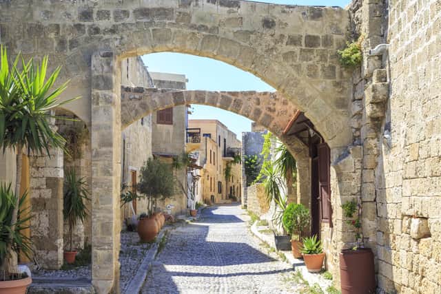 A typically picturesque street in Rhodes old town (Picture: Getty Images)
