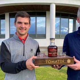 Gleneagles Hotel-attached Tom Higson, left, receives one of his prizes for winning the Tomatin Whisky-sponsored Highland Golf Links Pro Am