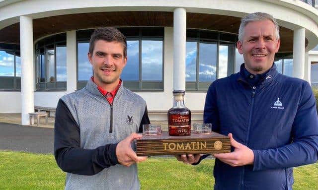 Gleneagles Hotel-attached Tom Higson, left, receives one of his prizes for winning the Tomatin Whisky-sponsored Highland Golf Links Pro Am