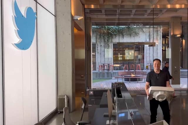 A screenshot from a video posted on Tesla chief Elon Musk's Twitter account on October 26, 2022, showing him carrying a sink as he enters the Twitter headquarters in San Francisco.