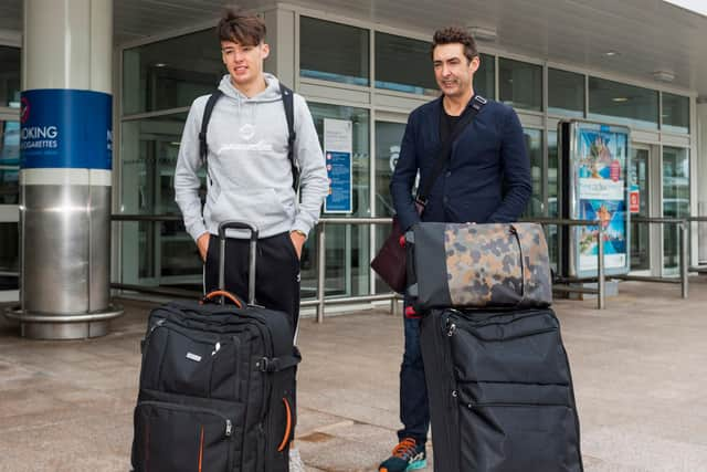 Aaron Hickey with his dad at Glasgow Airport.