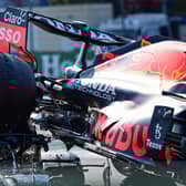The rear wheel of Max Verstappen's Red Bull Mercedes' collides with the helmet of Lewis Hamilton, with the halo safety feature absorbing most of the impact (Photo by ANDREJ ISAKOVIC/AFP via Getty Images)