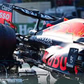 The rear wheel of Max Verstappen's Red Bull Mercedes' collides with the helmet of Lewis Hamilton, with the halo safety feature absorbing most of the impact (Photo by ANDREJ ISAKOVIC/AFP via Getty Images)