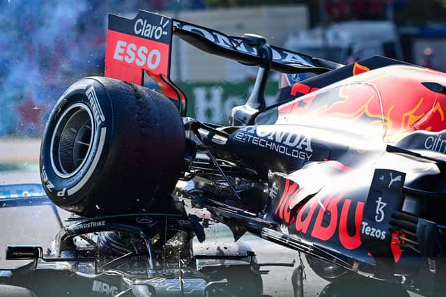 The rear wheel of Max Verstappen's Red Bull Mercedes' collides with the helmet of Lewis Hamilton, with the halo safety feature absorbing most of the impact (Photo by ANDREJ ISAKOVIC/AFP via Getty Images)