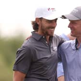 Ryder Cup captain Luke Donald, right, congratulates Tommy Fleetwood, captain of Great Britain and Ireland, after winning his singles match on the last day of the Hero Cup in Abu Dhabi. Picture: Oisin Keniry/Getty Images.
