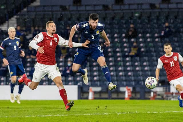 Grant Hanley heads home his goal for Scotland against Austria back in March.