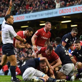 Wales' prop Tomas Francis (C) dives over the line during the Six Nations match against Scotland at the Principality Stadium in Cardiff (Photo by PAUL ELLIS/AFP via Getty Images)