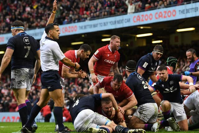 Wales' prop Tomas Francis (C) dives over the line during the Six Nations match against Scotland at the Principality Stadium in Cardiff (Photo by PAUL ELLIS/AFP via Getty Images)