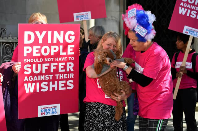 Activists from the Campaign for Dignity in Dying protest outside the Royal Courts of Justice in London (Picture: Kirsty O'Connor/PA)