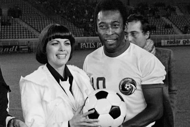 Pele in his New York Cosmos days with French singer Mireille Mathieu.