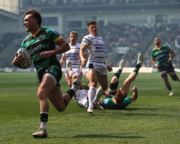 George Furbank of Northampton Saints breaks clear to score their first try during the 90-0 rout of Gloucester.