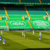 Both sets of players stand together in solidarity against racism ahead of the Scottish Premiership match between Celtic and Rangers at Celtic Park. (Photo by Craig Williamson / SNS Group)