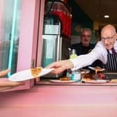 First Minister John Swinney serves up a pizza on the campaign trail. Picture: Jeff J Mitchell/Getty Images