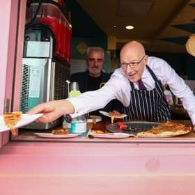 First Minister John Swinney serves up a pizza on the campaign trail. Picture: Jeff J Mitchell/Getty Images