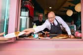 First Minister John Swinney serves up a pizza on the campaign trail. Picture: Jeff J Mitchell/Getty Images