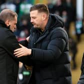 Dundee United manager Tam Courts (right) shakes hands with Celtic boss Ange Postecoglou at full-time.  (Photo by Craig Foy / SNS Group)