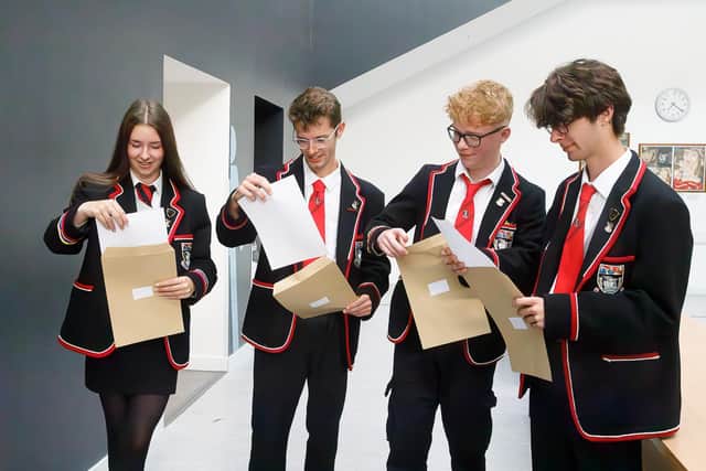 Pupils at Waid Academy opening their exam results in 2025.