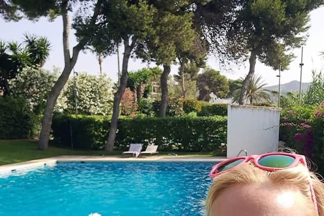 The pool in Holly Doyle's apartment complex in Marbella, pictured here before restrictions came into force, is closed due to water restrictions.