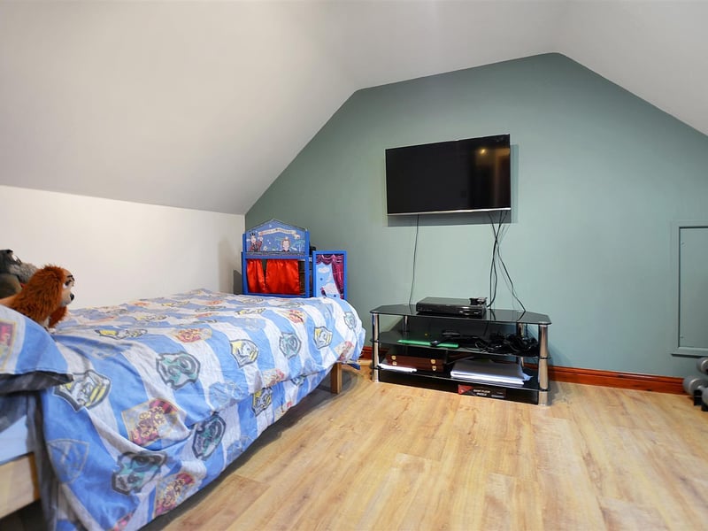 With radiator, laminate floor and roof window to the rear.