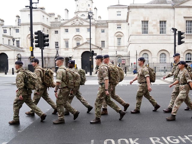Members of the armed forces in Whitehall, central London, ahead of the ceremonial procession of the coffin of Queen Elizabeth II from Buckingham Palace to Westminster Hall, London. Picture date: Wednesday September 14, 2022.