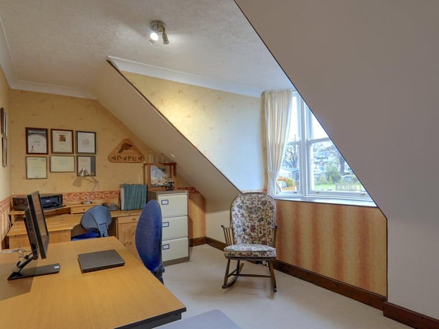 Upstairs one of the bedrooms has been turned into a home office