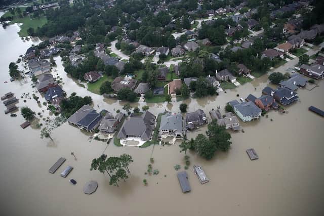 Flooded homes are shown near Lake Houston after Hurricane Harvey hit Texas in 2017. Climate change is causing storms to become more intense (Picture: Win McNamee/Getty Images)