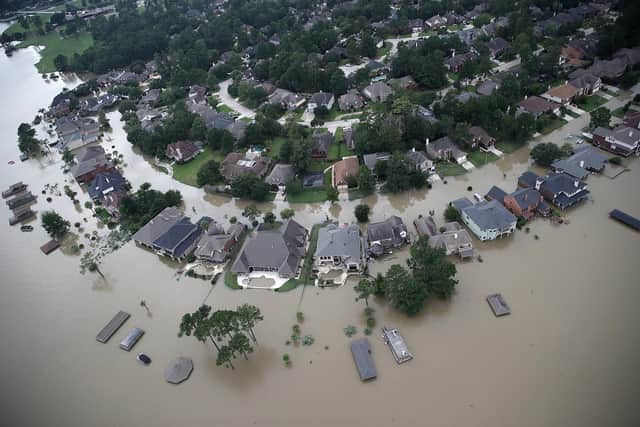 Flooded homes are shown near Lake Houston after Hurricane Harvey hit Texas in 2017. Climate change is causing storms to become more intense (Picture: Win McNamee/Getty Images)