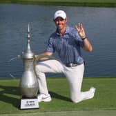 Rory McIlroy poses with the Hero Dubai Desert Classic trophy on the 18th green at Emirates Golf Club after landing a third title triumph in the DP World Tour event. Picture: Warren Little/Getty Images.