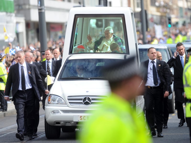 Pope Benedict continues through Edinburgh city centre.