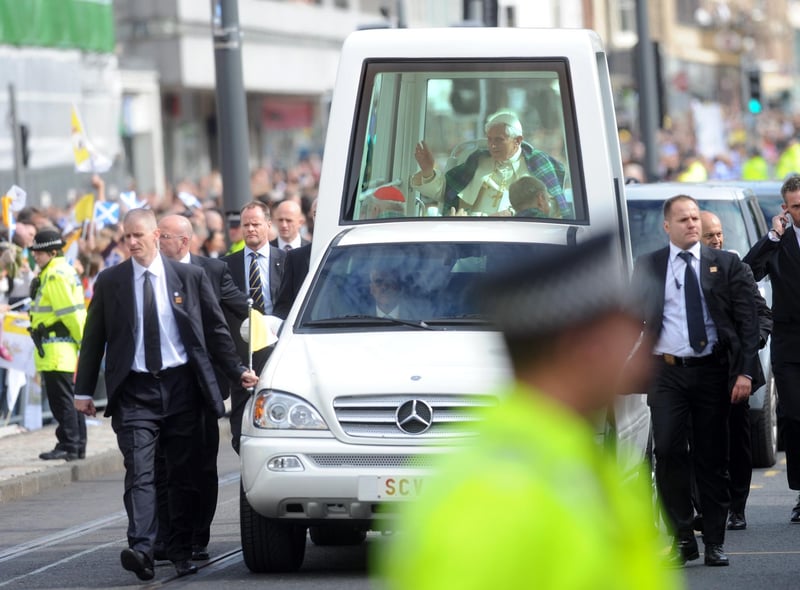 Pope Benedict continues through Edinburgh city centre.