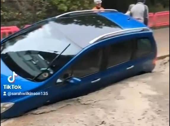 The driver and his passenger drove past a number of road closure signs in Scotland Road, Carnforth before finding themselves sinking into freshly poured concrete