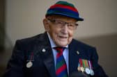 File photo dated 24/9/2020 of Captain Sir Tom Moore in Marston Moretaine, Bedford at the launch event for the Lloyd Scott Three Peaks Challenge. Captain Sir Tom Moore has died at the age of 100 after testing positive for Covid-19, his daughters Hannah and Lucy said in a statement. Issue date: Tuesday February 2, 2021. PA Photo. See PA story DEATH CaptainTom. Photo credit: Jacob King/PA Wire