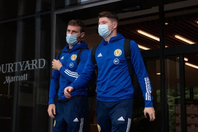 Motherwell right-back Stephen O'Donnell (left) and Hibs striker Kevin Nisbet depart the Scotland team hotel ahead of the flight to Austria for Tuesday's crucial World Cup qualifier. (Photo by Craig Foy / SNS Group)