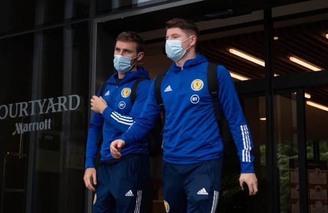 Motherwell right-back Stephen O'Donnell (left) and Hibs striker Kevin Nisbet depart the Scotland team hotel ahead of the flight to Austria for Tuesday's crucial World Cup qualifier. (Photo by Craig Foy / SNS Group)