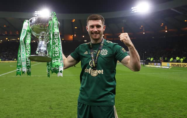 Celtic’s Anthony Ralston celebrates with the Premier Sports Cup trophy.