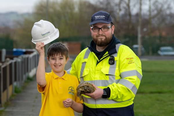 Harvey Dean-Evans, 9, from Wigan, as he is reunited with his pet tortoise 'Mary' which escaped from her home in August last year, after being found by grounds maintenance operative (Pic: Ian Robinson/ENWL/PA Wire )