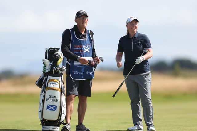 Gemma Dryburgh and her caddie talk over a shot during the third round of the Trust Golf Women's Scottish Open at Dundonald Links. Picture: Trust Golf Women's Scottish Open