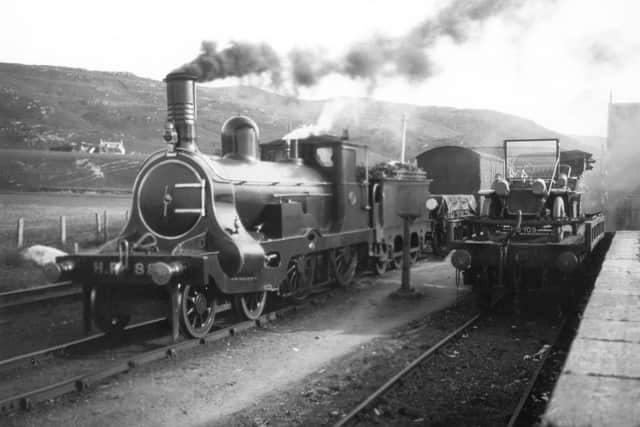 Cars being carried by train between Strathcarron and Kyle of Lochalsh in the early 1900s to save drivers a ferry journey and hazardous roads. Picture: Highland Railway Society collection.